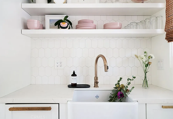 white and pink kitchen with gold hardware and faucet sink, interior inspiration