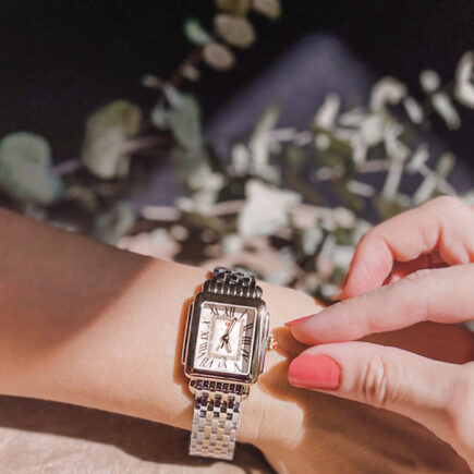 silver tank watch like cartier with a white face