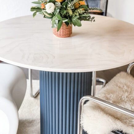 DIY round dining table with contrasting dowel rippled base