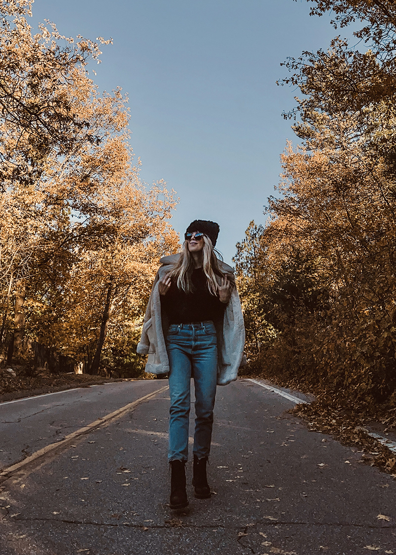 fall style, casual style with jeans, blonde on a tree lined street in the fall in lake arrowhead, love maegan