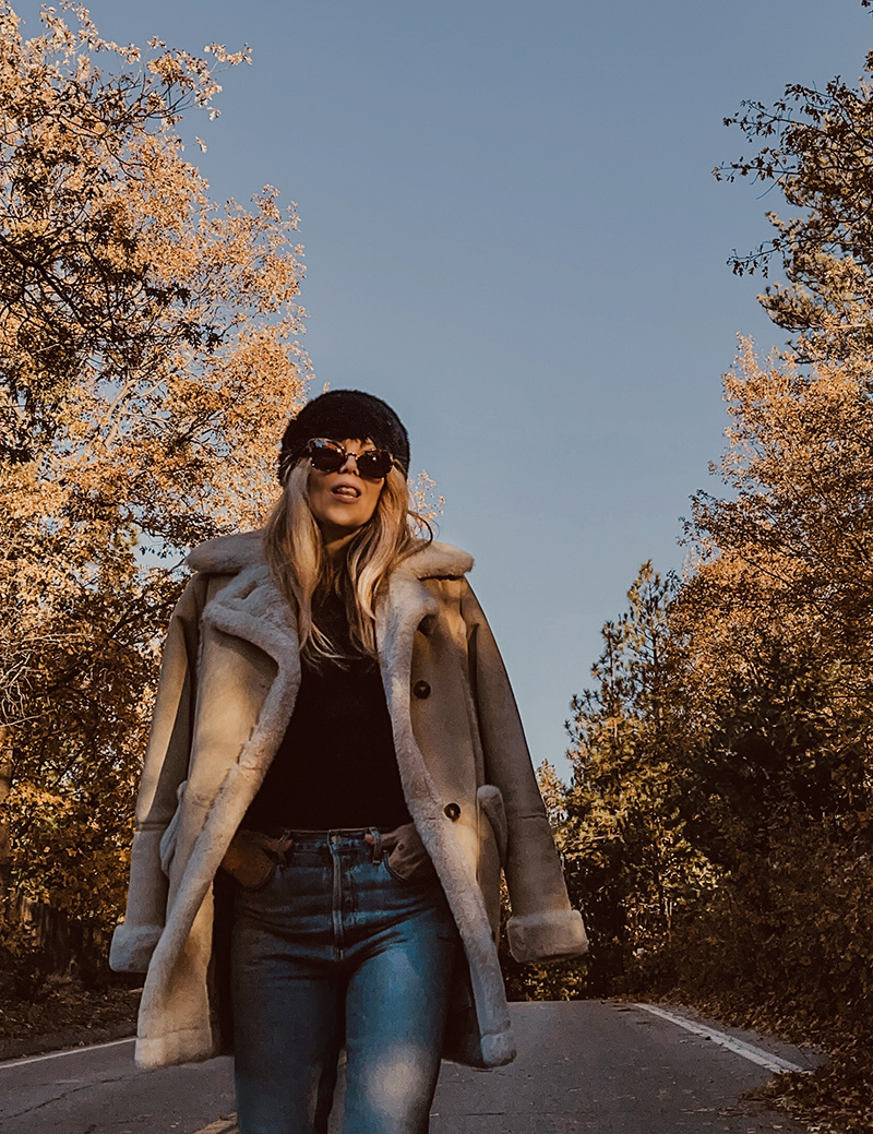 fall style, casual style with jeans, blonde on a tree lined street in the fall in lake arrowhead, love maegan