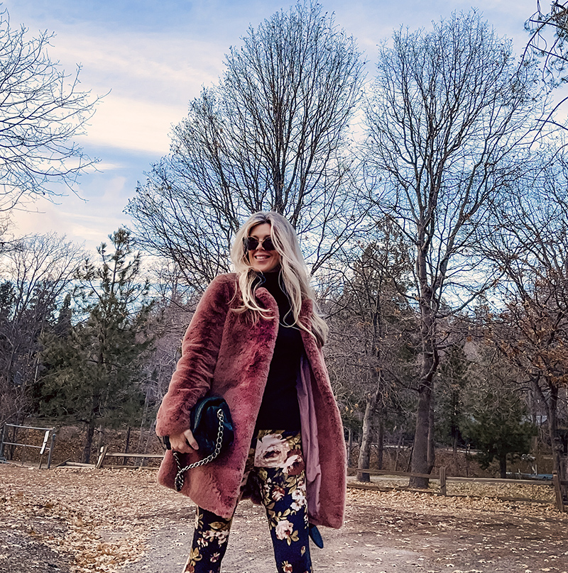 70s boho style, flared bell bottom floral pants with a black turtleneck, faux fur coat and doc martens