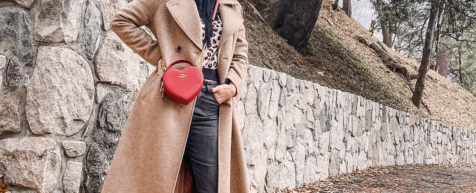 red heart coach bag-valentine's day look-vintage levis jeans with hem slit-brown coat