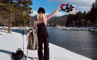 Black-and-pink-outfit-in-the-snow-with-snowshoes-on-the-lake arrowhead