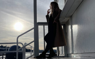 HERO-SUNSET-winter coat by the lake-dockside at the lake arrowhead marina