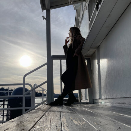 HERO-SUNSET-winter coat by the lake-dockside at the lake arrowhead marina