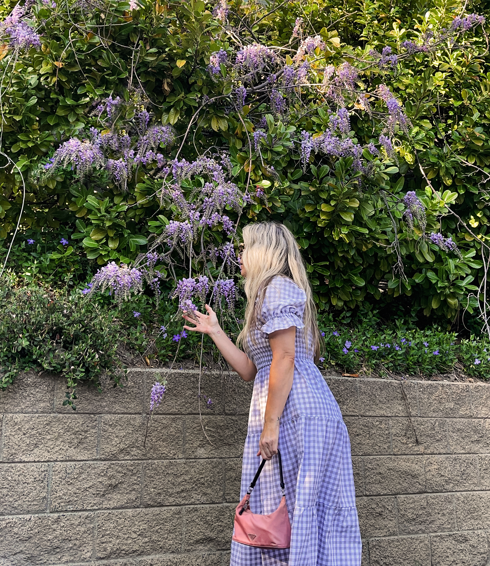 grey and white midi gingham dress with puff sleeves and tiers with vintage pink prada nylon bag and gray puma california casual sneakers in lake arrowhea