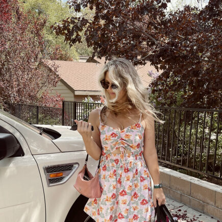 pink tropical cut out romper for sprint with vintage pink nylon prada bag and big beach waves hair