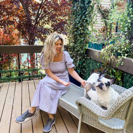 grey and white gingham dress with 90s gray pumas on the deck with the dogs