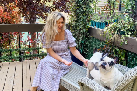 grey and white gingham dress with 90s gray pumas on the deck with the dogs