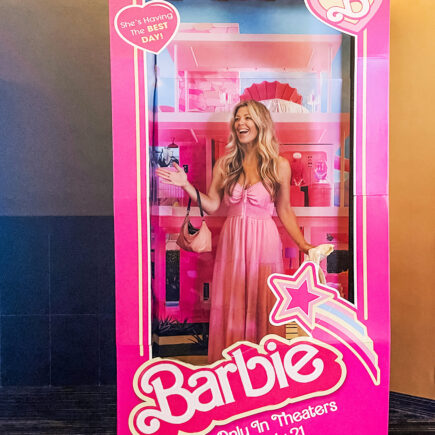 Barbie-movie-theater-barbie in the box-shes-having-the-best-day-pink-box-pink-dress-stereotypical-barbie-scaled