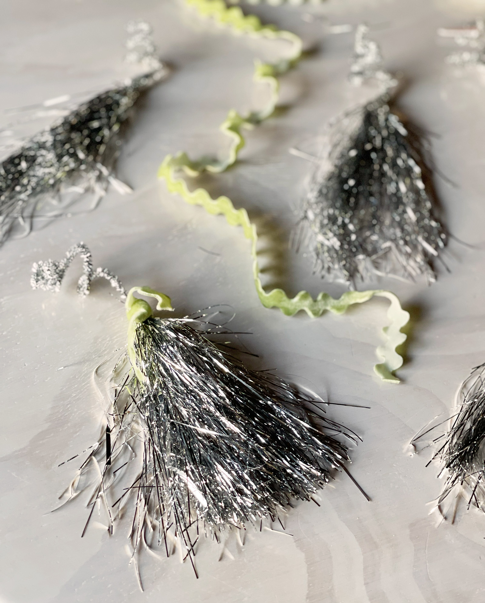 diy silver tinsel tassels Christmas tree ornaments gift wrapping toppers or wine bottle toppe