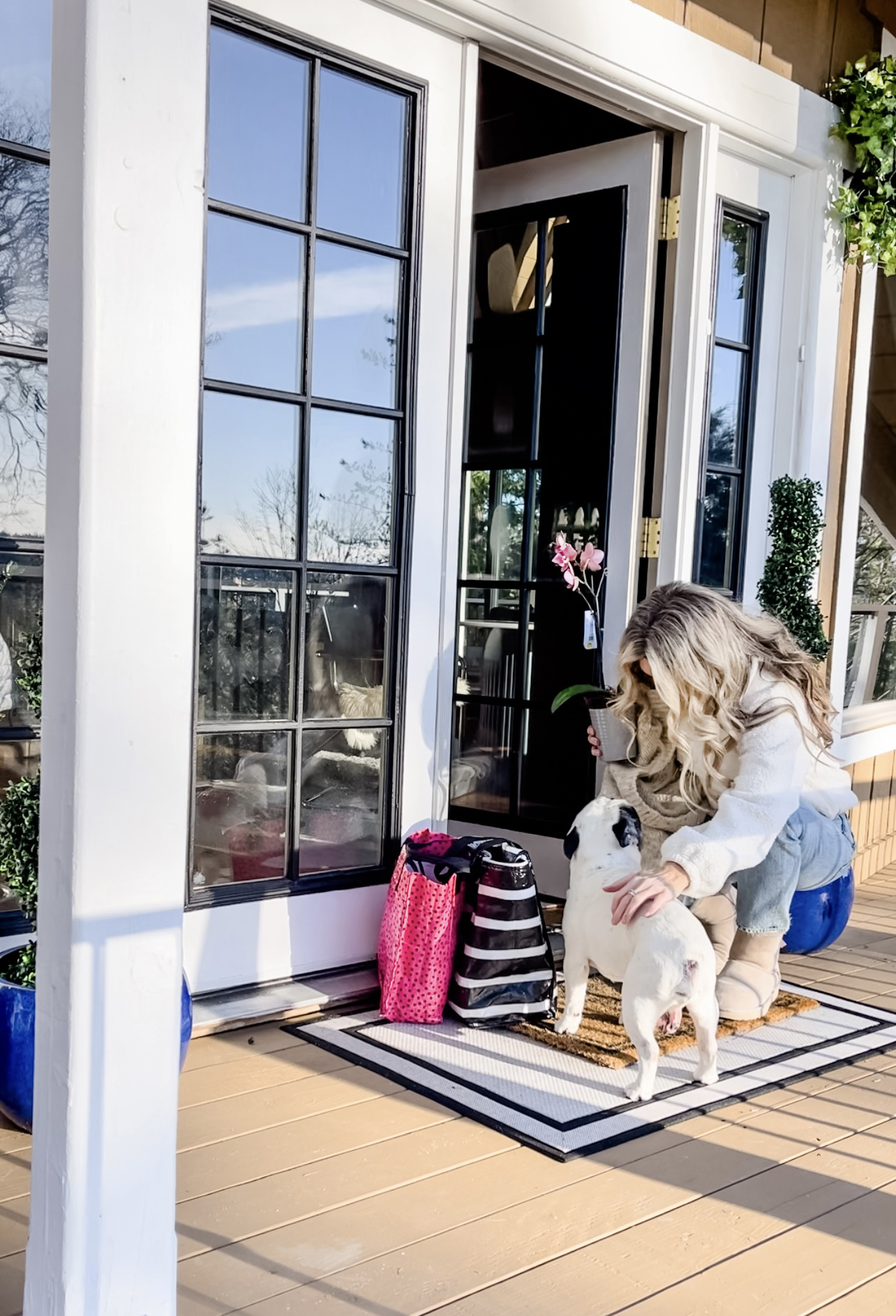 casual winter style, fleece shearling zip neck pullover with light was straight jeans and short ugg