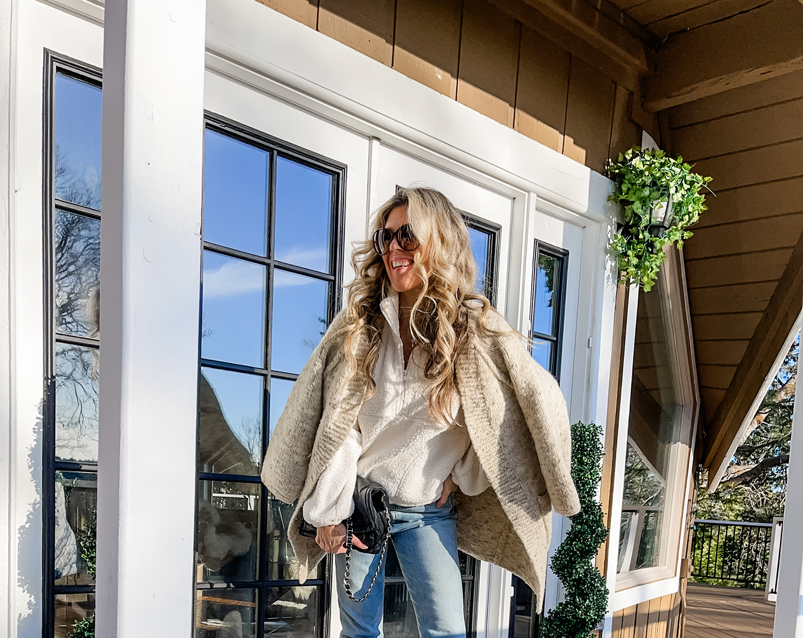 casual winter style, fleece shearling zip neck pullover with light was straight jeans and short ugg