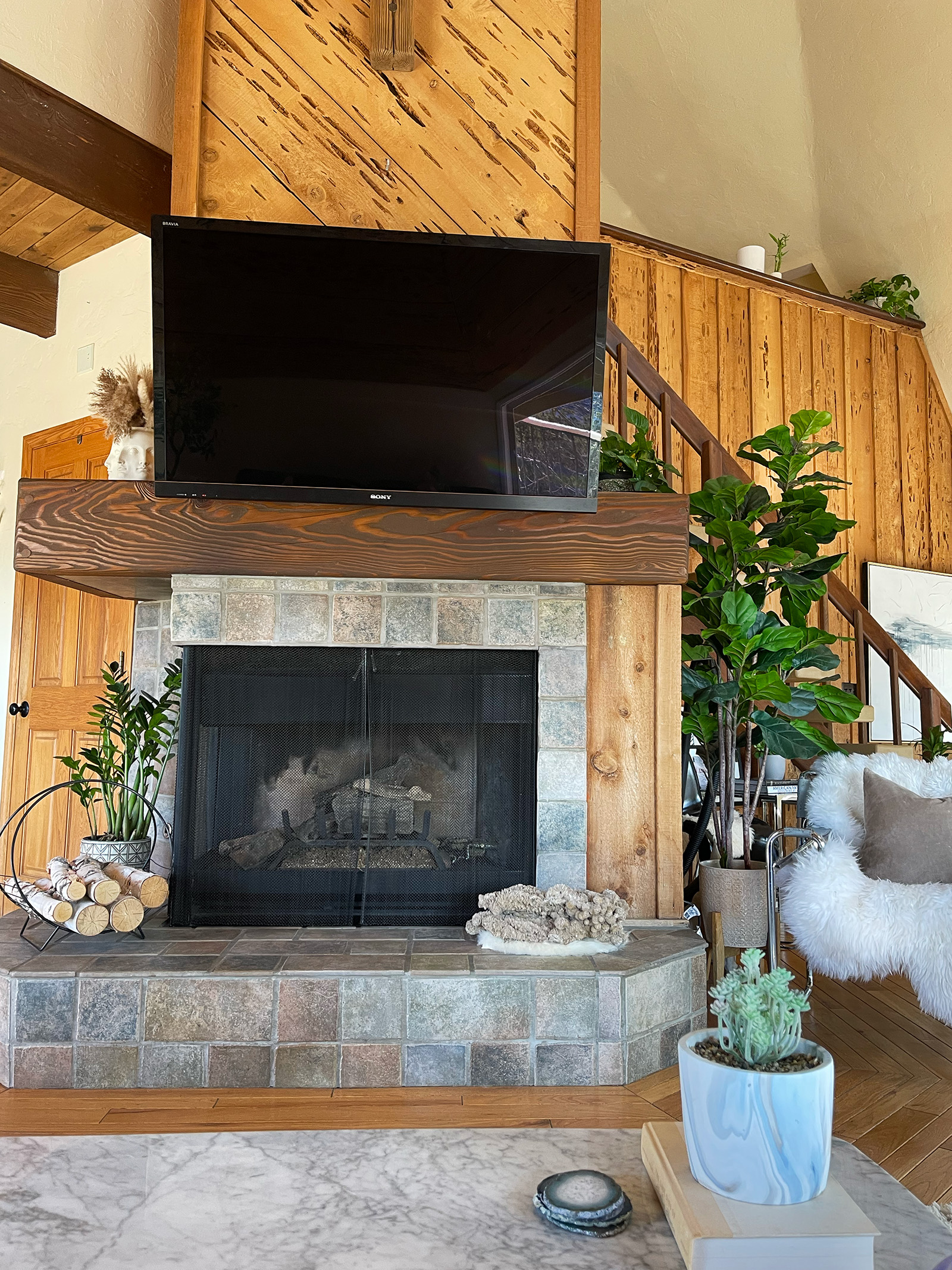 fireplace mantel in geodesic dome house with wormwood