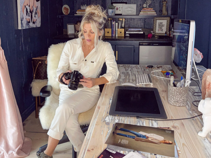 ivory unionalls sitting at desk in office