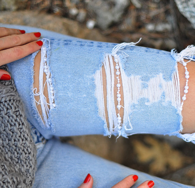 ripped jeans with pearls on them