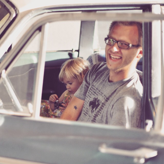 Father and daughter in vintage car