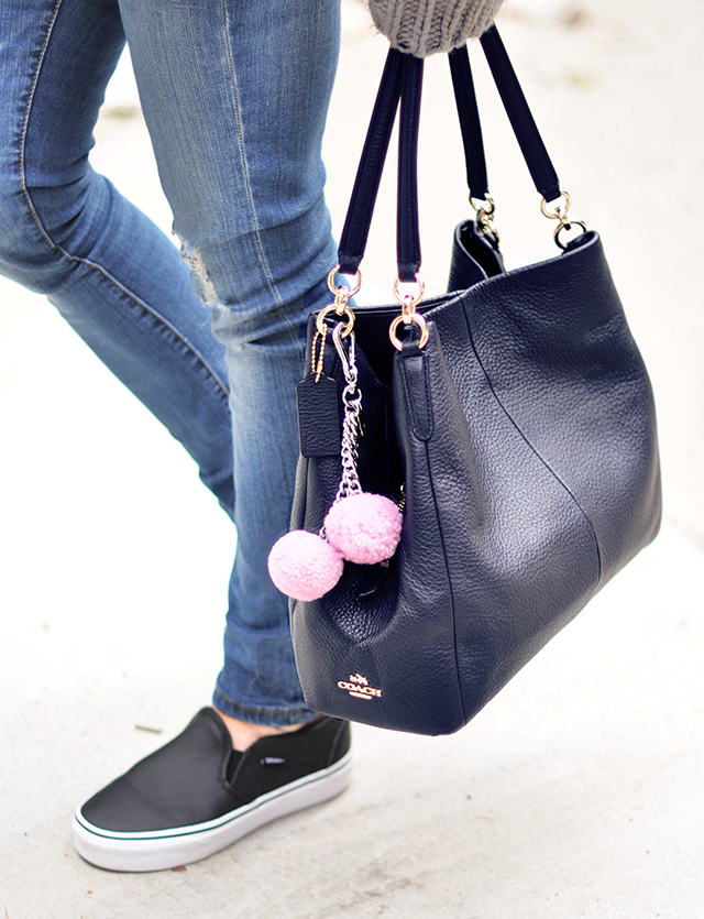 Navy coach bag with pink poms