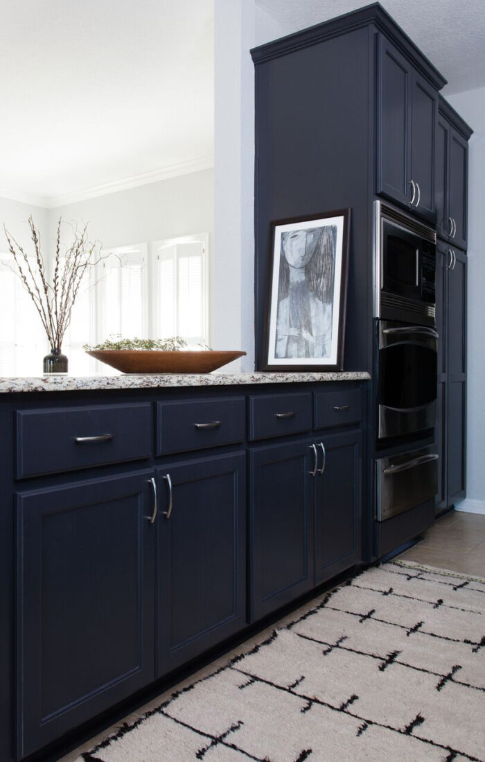 Stone-Textile_Kitchen_island - navy blue cabinets