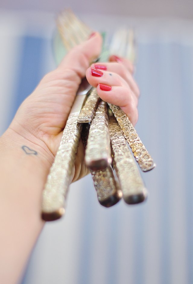 Vintage tarnished silverware with flower handles