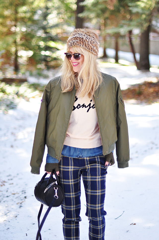 army green flight jacket_plaid pants_winter outfit in the snow