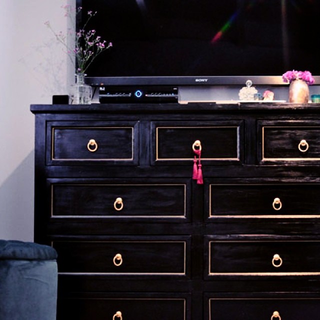 black and gold dresser