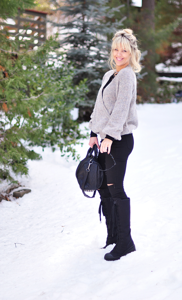 black and gray outfit in the snow