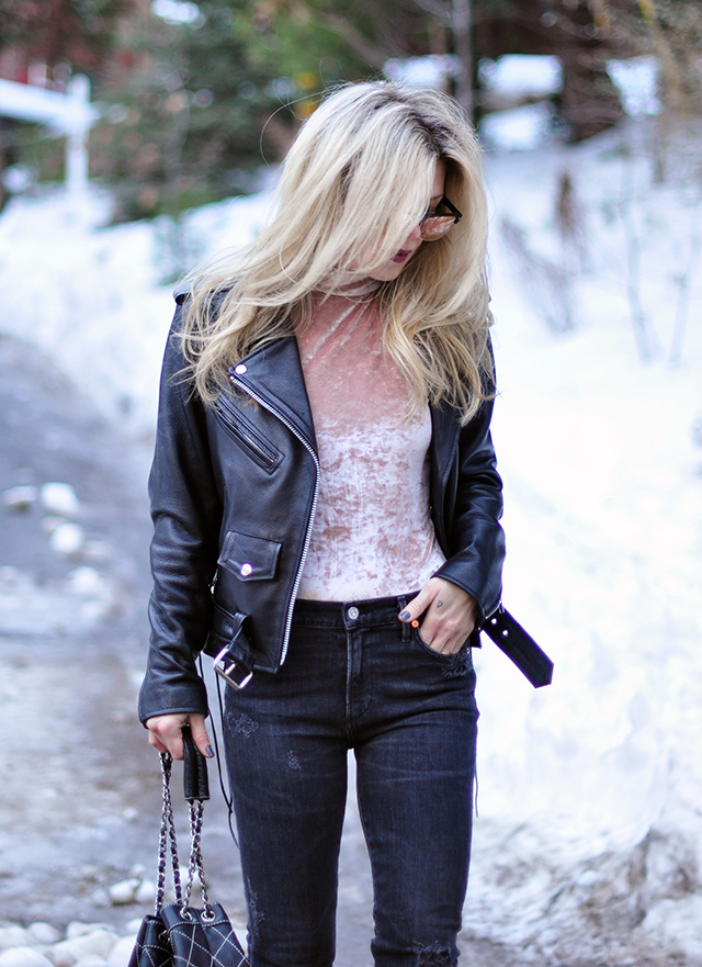 pink crushed velvet bodysuit, distressed denim, biker jacket, in the snow