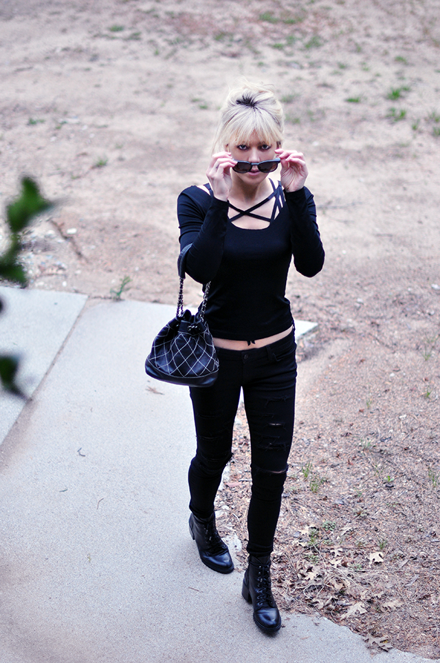 black outfit _ ripped skinny jeans _layering harness bra top