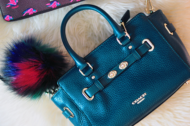 deep-teal-coach-bag-with-fur-bag-charm