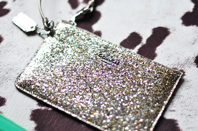 gold glitter coach wristlet