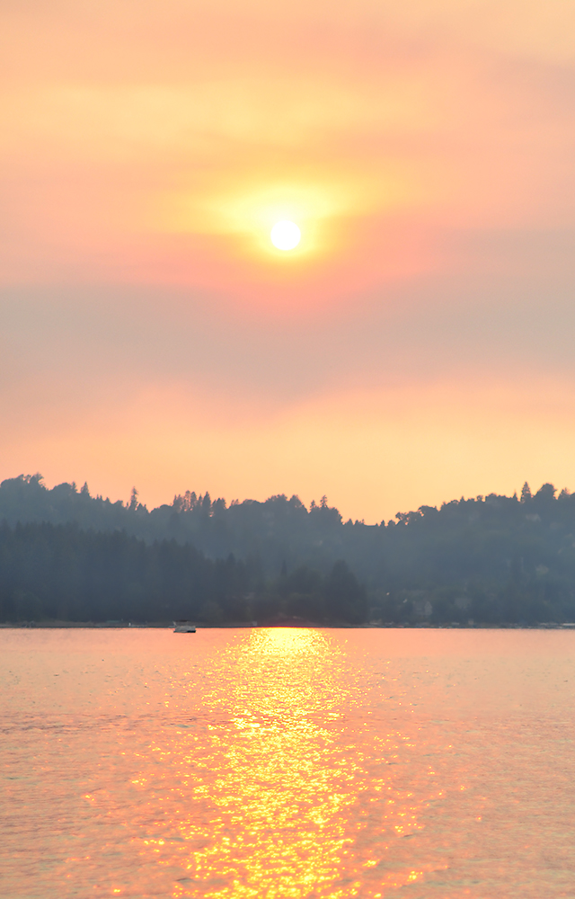 summer solstice sunset over lake arrowhead on the water