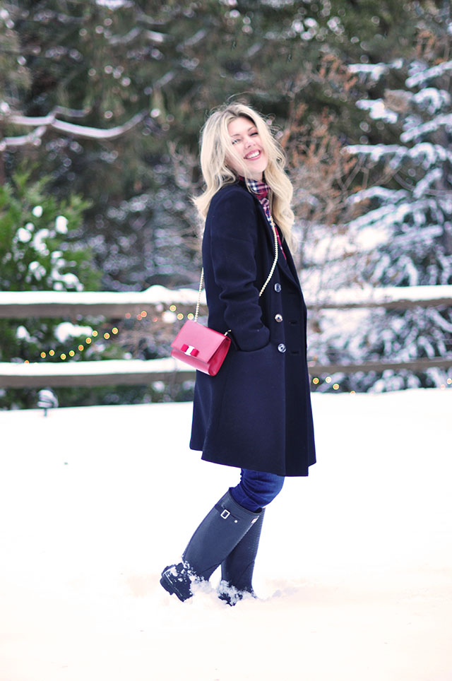 vintage coat  and hunter boots in the snow